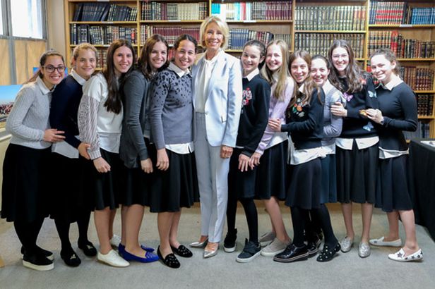 DeVos with students at the Manhattan High School for Girls on May 15, 2018